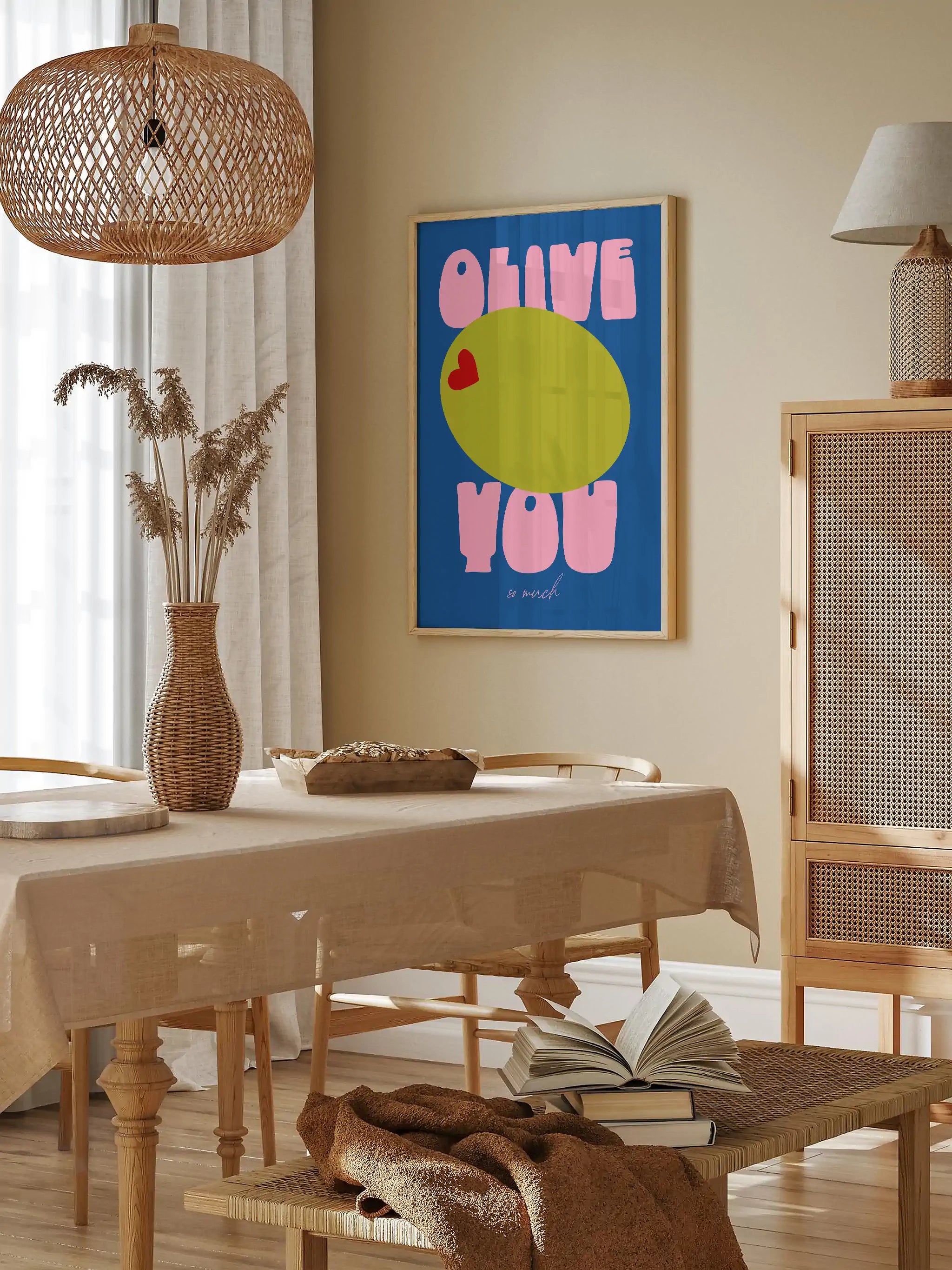 Colorful and quirky love-themed wall art with a green olive and heart